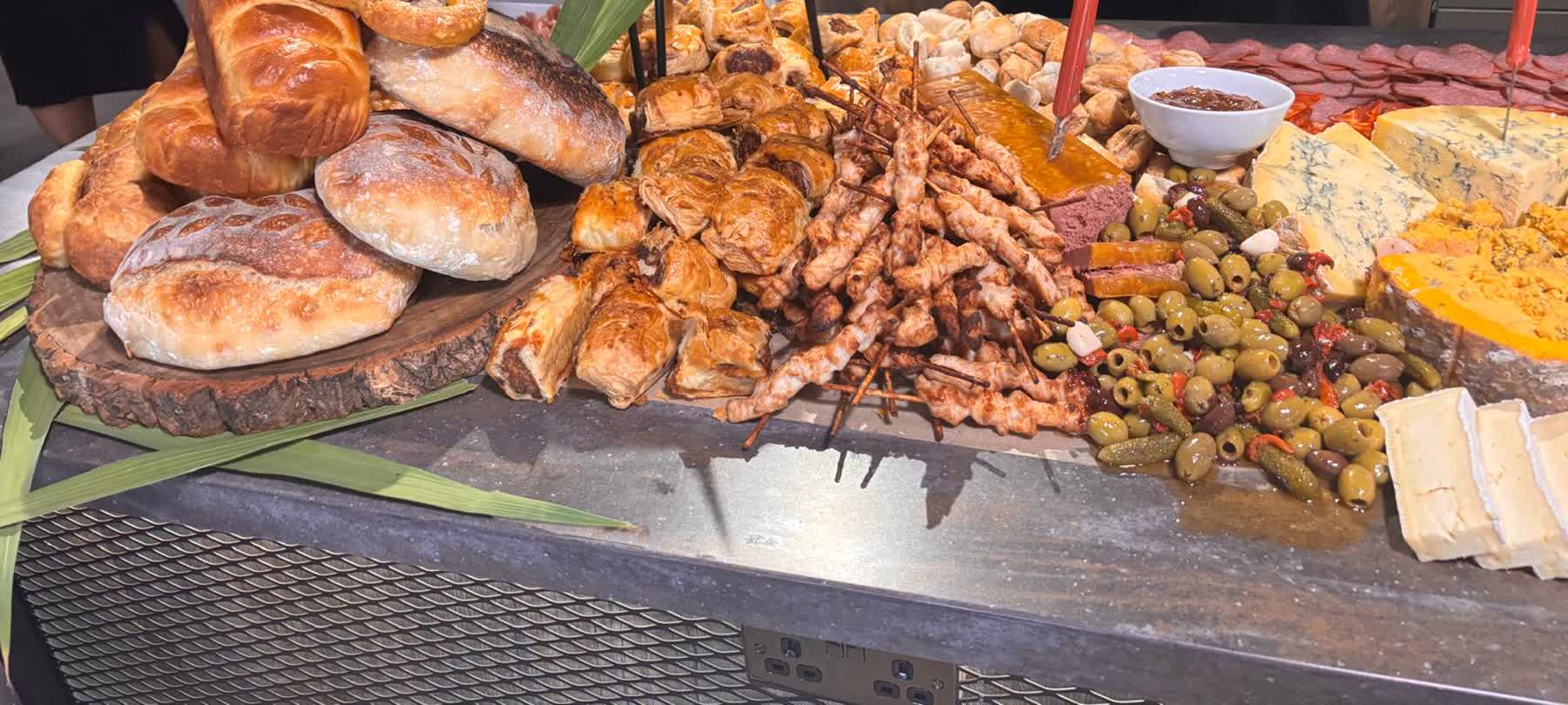 Fresh sourdough and pastries on a corporate catering table